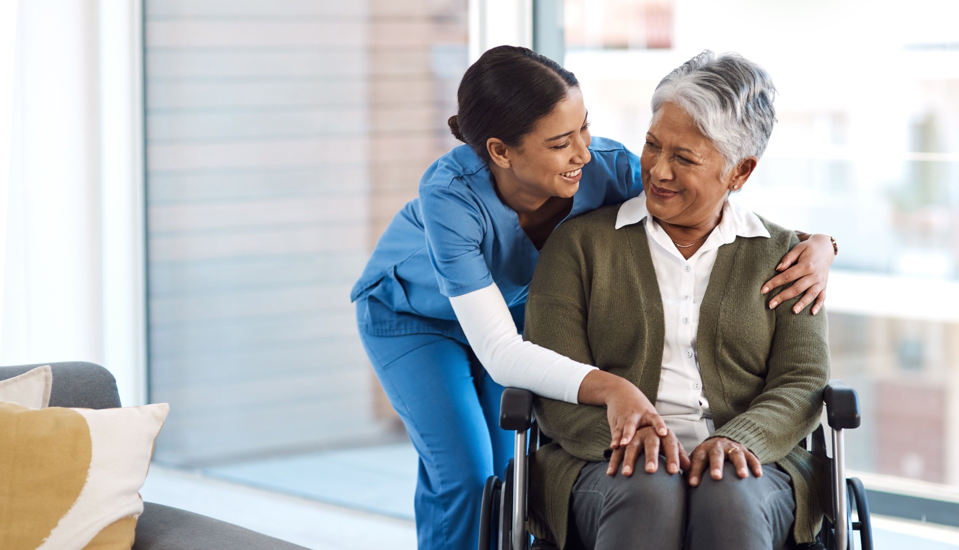 Cropped shot of an attractive young female nurse with a senior wheelchair-bound patient